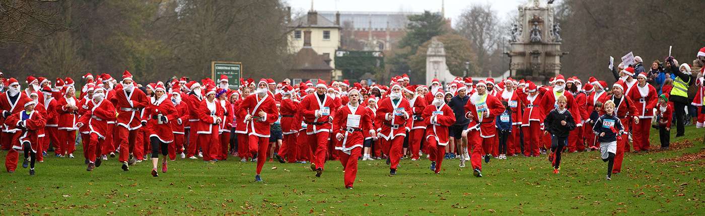 People running at Santa Fun Run event